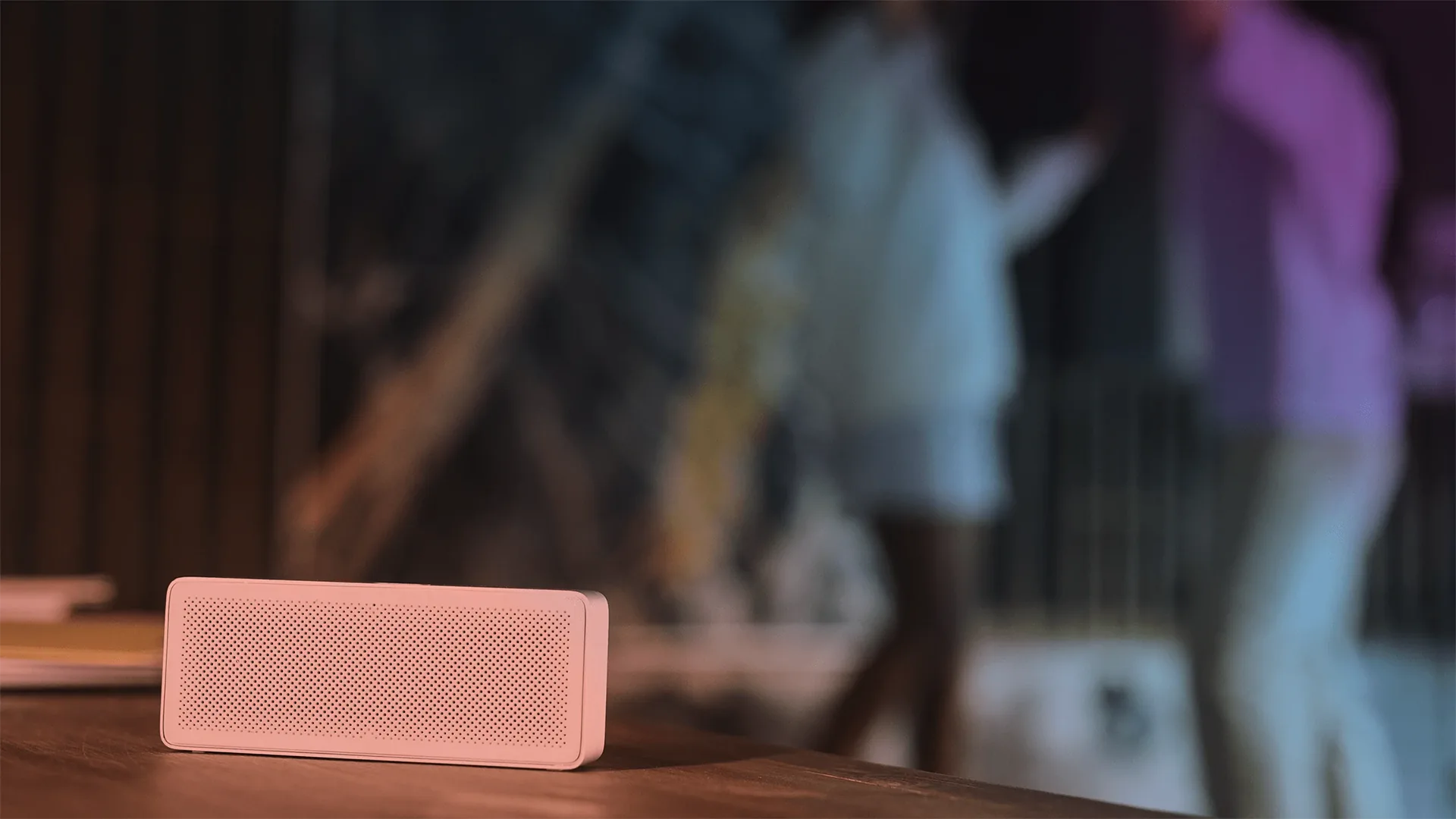 People dancing behind a speaker
